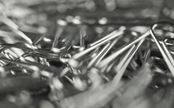 pile-of-paper-clips-shallow-focus-macro-dolly-shot_sjaytomz__F0000